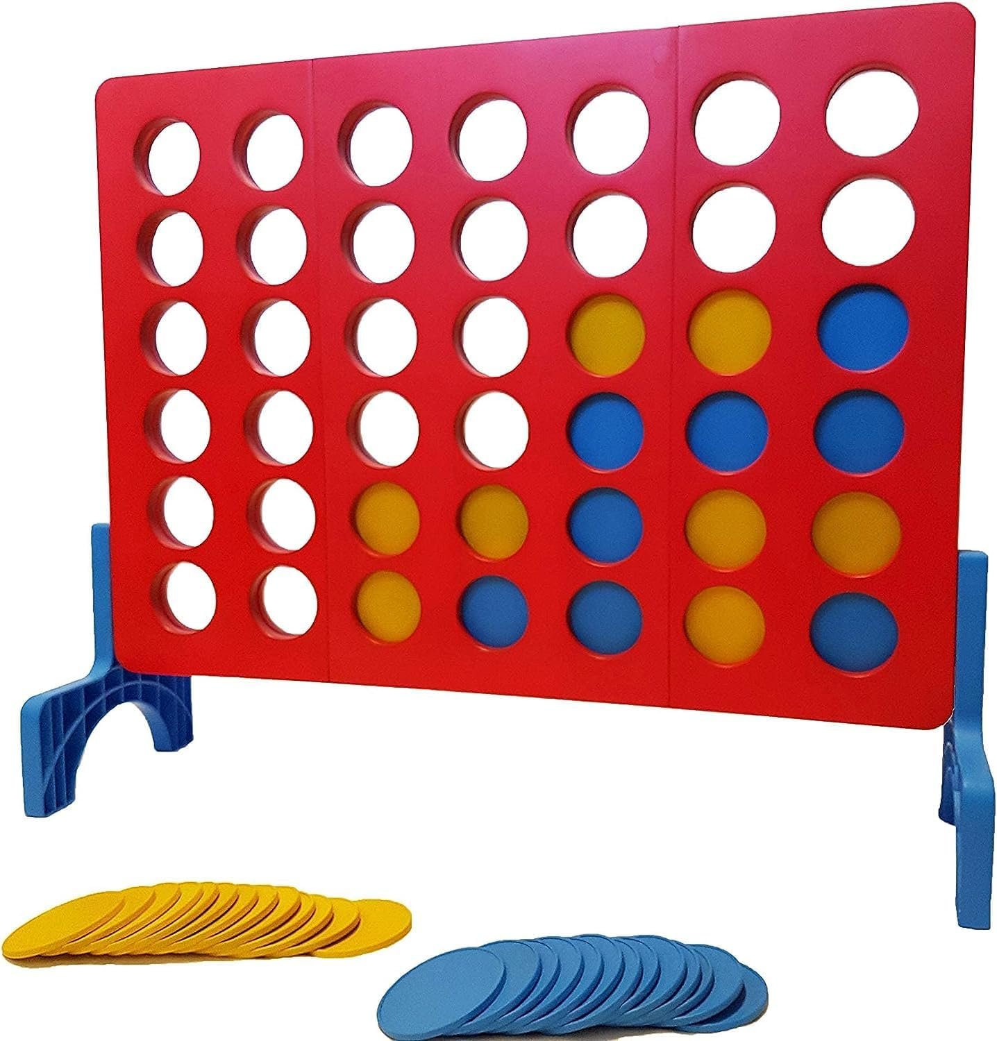Giant Connect Four game with red board, blue stand, and yellow/blue discs